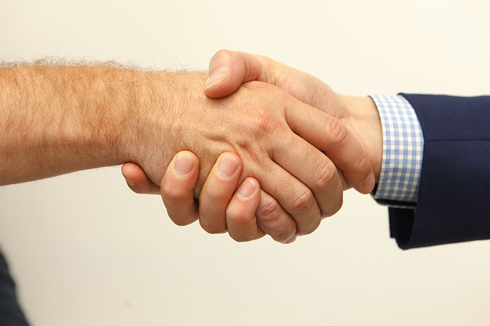Shaking hands with a reliable supplier